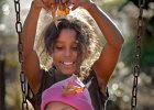 ParkFun-leafdropswing copy  Elisa Petty, 10, top, drops a handful of leaves on her friend Kiara Lyles, 6, bottom, as the children play together at Chapel Street Park in Spartanburg, SC Sunday afternoon, 11-26-06. (AP Photo/Herald-Journal/Tim Kimzey)